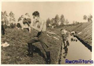 CHORES Wehrmacht Troops Grooming Themselves in Water Filled Ditch 
