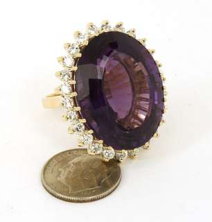 this is a massive 14k gold and amethyst ladies dress ring