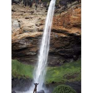  Man Looks Up at Sipi Falls, Uganda, East Africa, Africa 