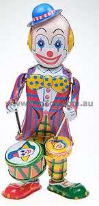 WIND UP TIN TOY CLOWN BEATING DRUM IN BOX 21cm  