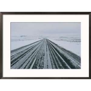  A snow covered road in a winter scene Scenic Framed Art 