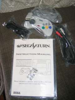   with box manual and all accessories as listed in the box sega saturn